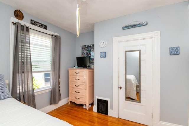 18 Dighton St Unit 18, Boston, MA 02135 - bedroom featuring wood finished floors and baseboards