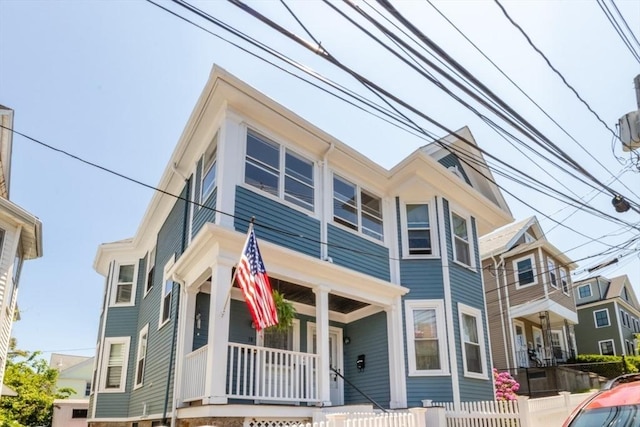 18 Dighton St Unit 18, Boston, MA 02135 - view of front facade with a porch and a fenced front yard