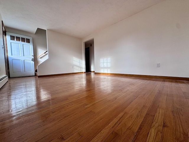 unfurnished room featuring hardwood / wood-style floors