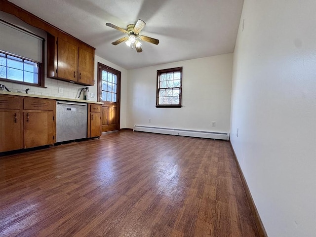 kitchen with dishwasher, dark hardwood / wood-style floors, decorative backsplash, baseboard heating, and ceiling fan