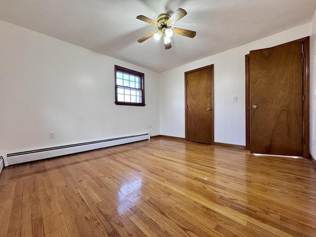 unfurnished bedroom with a baseboard heating unit, ceiling fan, and light hardwood / wood-style floors