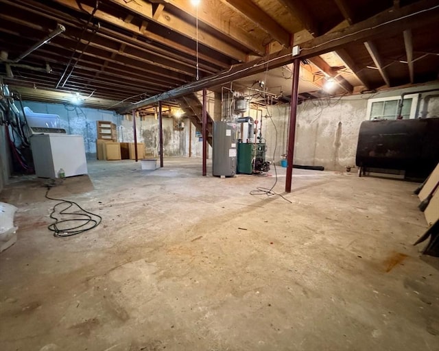 basement with washer / dryer and electric water heater