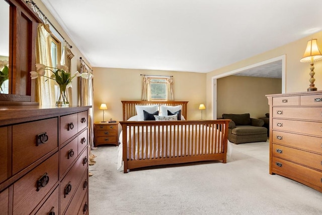 bedroom featuring light colored carpet