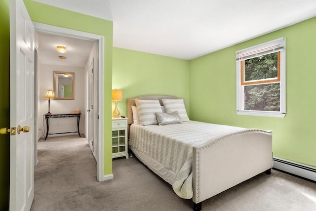 bedroom featuring a baseboard radiator, carpet flooring, and baseboards