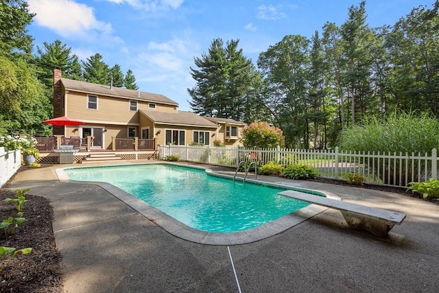 view of pool featuring a fenced in pool, fence, a deck, and a patio