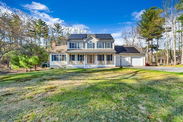 13 Old Gardner Rd, Westminster, MA 01473 - colonial house with a garage, a front lawn, aphalt driveway, covered porch, and solar panels