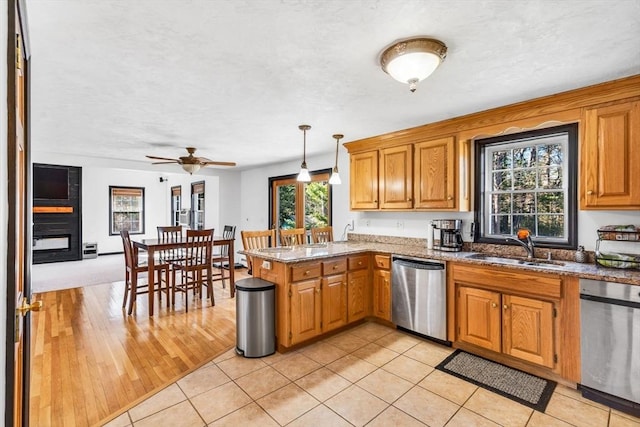 13 Old Gardner Rd, Westminster, MA 01473 - kitchen featuring stainless steel dishwasher, pendant lighting, a peninsula, ceiling fan, and a sink