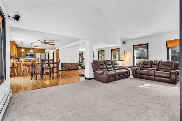 13 Old Gardner Rd, Westminster, MA 01473 - living area featuring a ceiling fan, wood finished floors, high vaulted ceiling, a baseboard heating unit, and carpet flooring