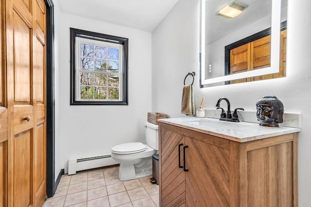 13 Old Gardner Rd, Westminster, MA 01473 - bathroom with vanity, toilet, tile patterned floors, and a baseboard radiator