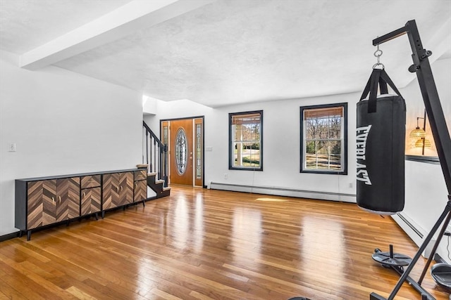 13 Old Gardner Rd, Westminster, MA 01473 - interior space with baseboard heating, wood finished floors, stairway, baseboards, and beamed ceiling