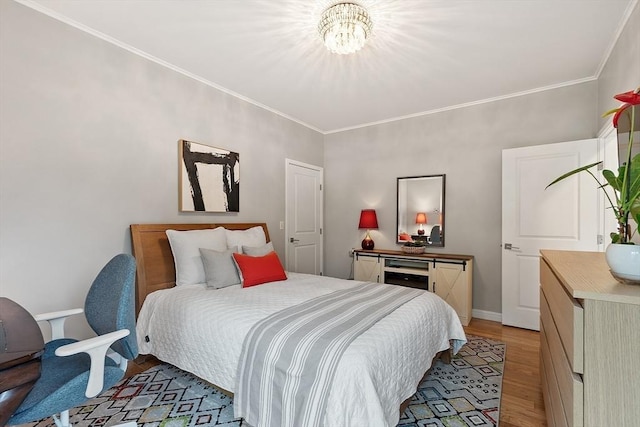 4 Greenfield Ln Unit 4, Concord, MA 01742 - bedroom with a chandelier, light wood finished floors, ornamental molding, and baseboards