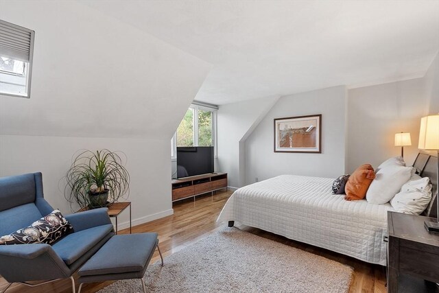 4 Greenfield Ln Unit 4, Concord, MA 01742 - bedroom featuring wood finished floors, vaulted ceiling, and baseboards
