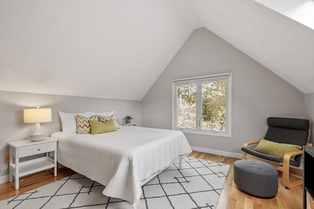 4 Greenfield Ln Unit 4, Concord, MA 01742 - bedroom with light wood-style flooring, lofted ceiling, and baseboards