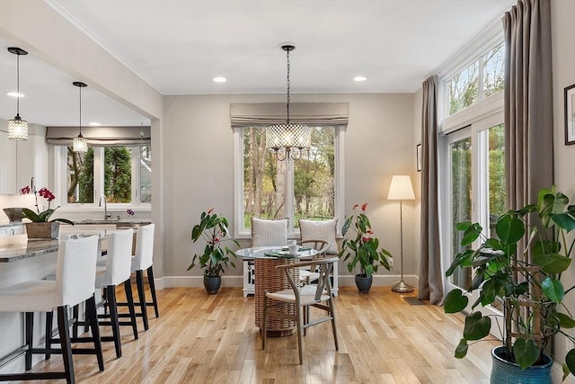 4 Greenfield Ln Unit 4, Concord, MA 01742 - dining room with baseboards, healthy amount of natural light, light wood-style floors, ornamental molding, and recessed lighting