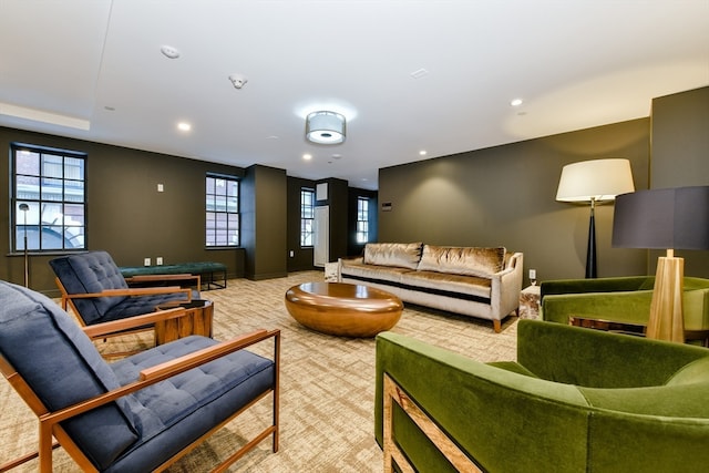 interior space with light colored carpet and a healthy amount of sunlight