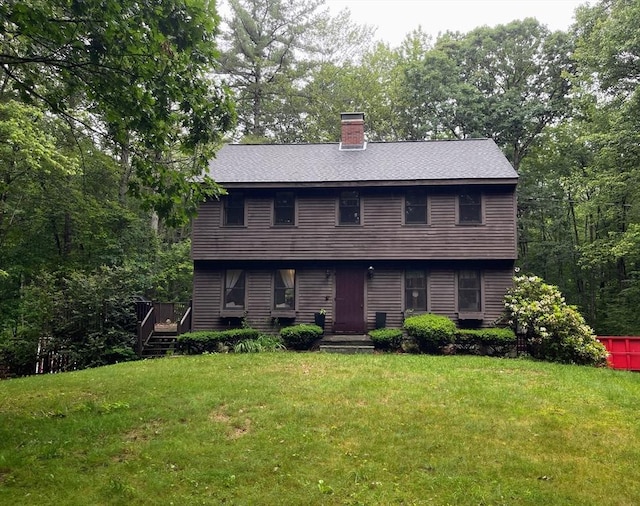 330 Arbor St, Lunenburg, MA 01462 - colonial inspired home featuring a front lawn, a chimney, and roof with shingles
