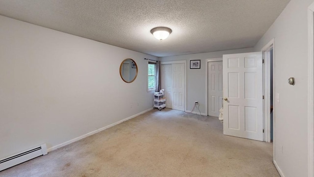330 Arbor St, Lunenburg, MA 01462 - unfurnished room with baseboard heating, light colored carpet, and a textured ceiling