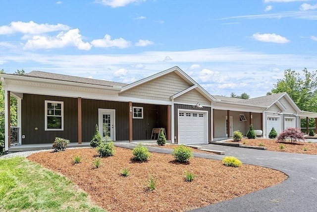 ranch-style house featuring a garage and a porch