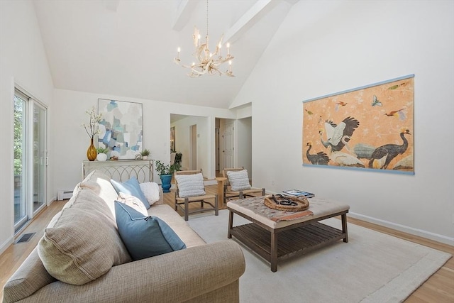 living room with visible vents, wood finished floors, high vaulted ceiling, a baseboard heating unit, and a chandelier