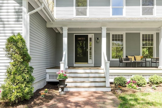 doorway to property with a porch