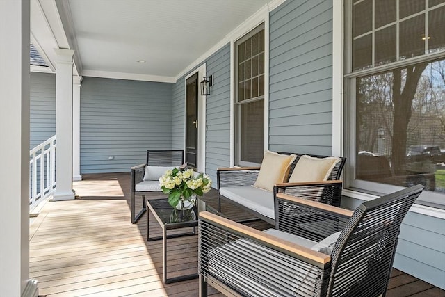 wooden terrace featuring covered porch