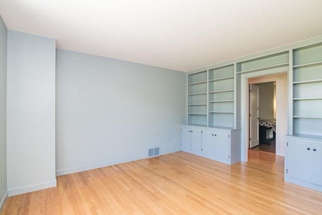 53 Iduna Ln, Amherst, MA 01002 - unfurnished room featuring light wood finished floors and built in features