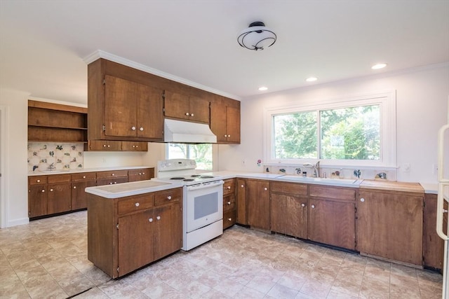 53 Iduna Ln, Amherst, MA 01002 - kitchen with white electric range, under cabinet range hood, brown cabinetry, light countertops, and recessed lighting