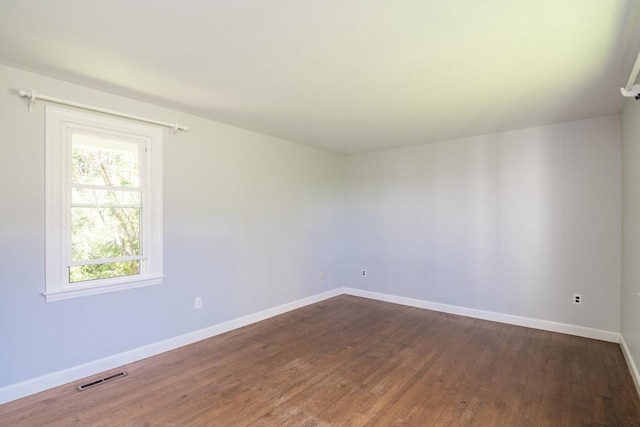 53 Iduna Ln, Amherst, MA 01002 - empty room featuring dark wood finished floors and baseboards