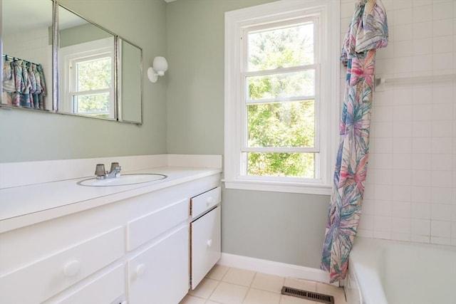 53 Iduna Ln, Amherst, MA 01002 - full bathroom with vanity, healthy amount of natural light, tile patterned floors, and shower / bathtub combination with curtain