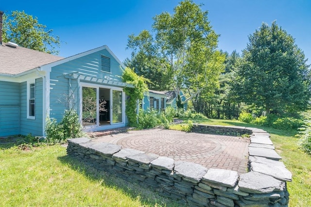 53 Iduna Ln, Amherst, MA 01002 - back of house with a yard, a patio, and roof with shingles