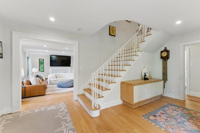 15 Park Ave, Newton, MA 02458 - stairway with wood finished floors, ornamental molding, baseboards, and recessed lighting