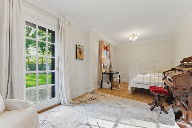 15 Park Ave, Newton, MA 02458 - bedroom with wood finished floors, ornamental molding, access to outside, and baseboards