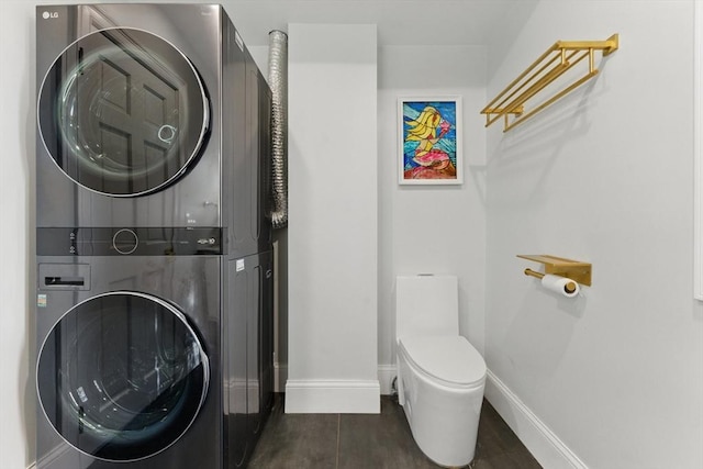 15 Park Ave, Newton, MA 02458 - washroom featuring estacked washer and dryer and baseboards
