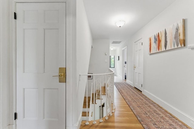 15 Park Ave, Newton, MA 02458 - hall featuring an upstairs landing, wood finished floors, and baseboards