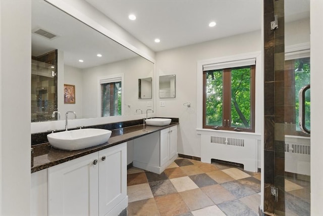 15 Park Ave, Newton, MA 02458 - full bath featuring radiator, a stall shower, double vanity, and recessed lighting