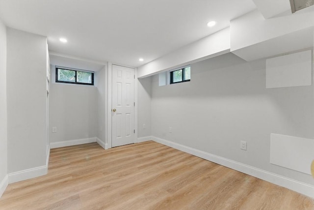 15 Park Ave, Newton, MA 02458 - below grade area with light wood-style floors, baseboards, healthy amount of natural light, and recessed lighting