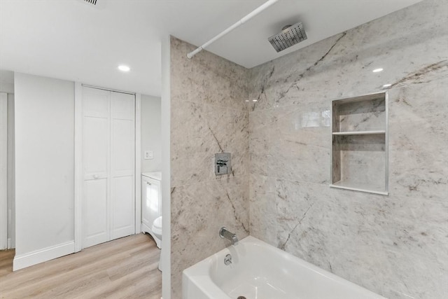 15 Park Ave, Newton, MA 02458 - bathroom with wood finished floors,  shower combination, toilet, and recessed lighting