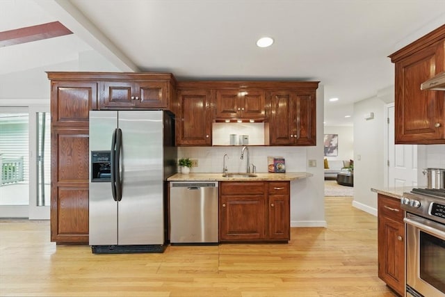 6 Willow Park, Wellesley, MA 02481 - kitchen with appliances with stainless steel finishes, a sink, decorative backsplash, light wood-style flooring, and recessed lighting