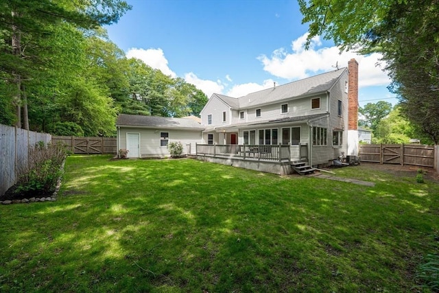 6 Willow Park, Wellesley, MA 02481 - rear view of house with a gate and a chimney