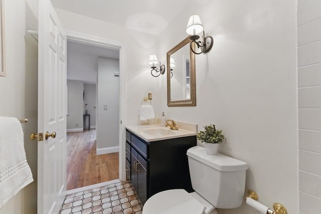 6 Willow Park, Wellesley, MA 02481 - bathroom featuring vanity, toilet, baseboards, and wood finished floors