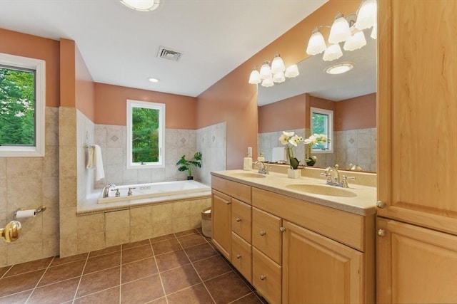 6 Willow Park, Wellesley, MA 02481 - full bath featuring tile patterned floors, double vanity, a garden tub, wainscoting, and tile walls