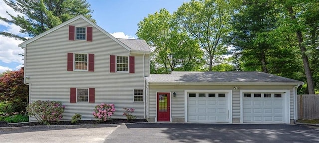6 Willow Park, Wellesley, MA 02481 - traditional home featuring a garage and asphalt driveway
