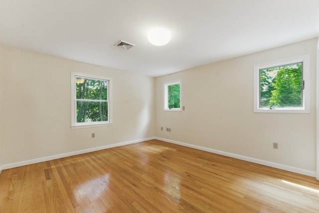 6 Willow Park, Wellesley, MA 02481 - empty room featuring healthy amount of natural light, light wood finished floors, and baseboards