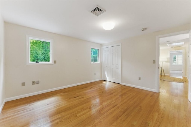 6 Willow Park, Wellesley, MA 02481 - unfurnished bedroom featuring light wood-style floors, baseboards, and a closet