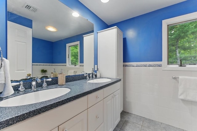 6 Willow Park, Wellesley, MA 02481 - full bathroom featuring tile walls, double vanity, tile patterned flooring, and a wainscoted wall