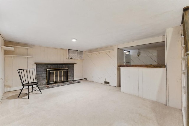 6 Willow Park, Wellesley, MA 02481 - unfurnished living room with carpet floors, wood walls, and a fireplace