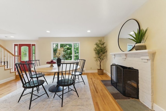6 Willow Park, Wellesley, MA 02481 - dining room featuring a fireplace, light wood finished floors, stairway, baseboards, and recessed lighting