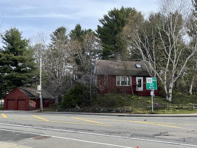 301 May St, Worcester, MA 01602 - view of front facade with a garage and brick siding