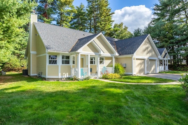 view of front of property with aphalt driveway, covered porch, a front yard, an attached garage, and a chimney