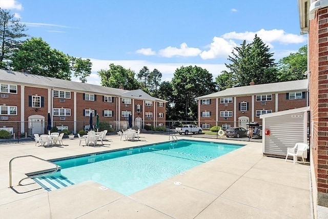 view of swimming pool featuring a patio